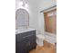 Cozy bathroom with tiled shower and tub, modern vanity, neutral paint and wood-look floors at 602 Davenport Pl, Canton, GA 30115