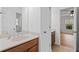 Bathroom with double sinks, tile floors, and a connected room at 602 Davenport Pl, Canton, GA 30115