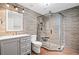 Modern bathroom featuring an updated shower, granite countertop, and updated vanity at 602 Davenport Pl, Canton, GA 30115