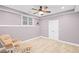 Cozy bedroom featuring natural light, new carpet, and a relaxing chair at 602 Davenport Pl, Canton, GA 30115
