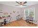 Study room with hardwood floors, two desks, and a keyboard by the window at 602 Davenport Pl, Canton, GA 30115