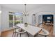 Bright dining room with elegant chandelier, table with seating, and a view of the study at 602 Davenport Pl, Canton, GA 30115