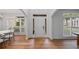 Welcoming entryway featuring hardwood floors, white trim, and ample natural light from surrounding windows at 602 Davenport Pl, Canton, GA 30115