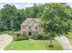 Stunning two-story brick home with a well-manicured lawn and a paved driveway at 602 Davenport Pl, Canton, GA 30115