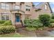 Charming front entrance with a blue door, brick steps, and professionally landscaped garden at 602 Davenport Pl, Canton, GA 30115