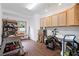 A well-lit garage featuring ample storage cabinets and a convenient utility sink for various projects and tasks at 602 Davenport Pl, Canton, GA 30115