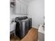 Well-equipped laundry room with modern appliances and storage at 602 Davenport Pl, Canton, GA 30115