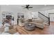 Open-concept living room with fireplace and staircase at 602 Davenport Pl, Canton, GA 30115