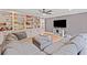 Spacious living room features custom built-ins, recessed lighting, ceiling fan, and hardwood floors at 602 Davenport Pl, Canton, GA 30115