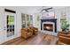 Comfortable living room area with fireplace and doors to outdoor space at 602 Davenport Pl, Canton, GA 30115
