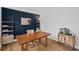 Home office with custom shelving, modern decor, and plenty of natural light at 602 Davenport Pl, Canton, GA 30115
