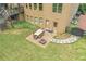Backyard patio with outdoor seating and manicured landscaping, ideal for dining and entertaining at 602 Davenport Pl, Canton, GA 30115