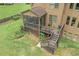 Cozy screened-in porch and wooden deck leading to a spacious backyard, perfect for relaxing outdoors at 602 Davenport Pl, Canton, GA 30115