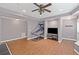 Recreation room featuring a basketball hoop, TV, and hardwood floors at 602 Davenport Pl, Canton, GA 30115