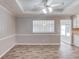 The dining room includes a stylish ceiling fan and plenty of natural light at 1980 Mcconnell Rd, Grayson, GA 30017