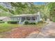 Charming single-story home with a cozy front porch and well-maintained landscaping at 1980 Mcconnell Rd, Grayson, GA 30017