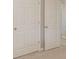 Hallway area with a light carpet and white doors at 1980 Mcconnell Rd, Grayson, GA 30017
