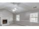 A spacious living room with a fireplace and neutral color scheme at 1980 Mcconnell Rd, Grayson, GA 30017