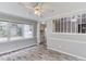Comfortable living room featuring stylish flooring and a view into the kitchen at 1980 Mcconnell Rd, Grayson, GA 30017
