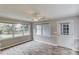 Bright sunroom with large windows, a ceiling fan, and access to the backyard at 1980 Mcconnell Rd, Grayson, GA 30017