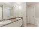 Bathroom featuring dual sinks, vanity, and decorative mirror at 2341 Alden, Jonesboro, GA 30236