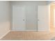 Bedroom with neutral carpet and two large closets at 2341 Alden, Jonesboro, GA 30236