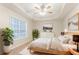 Stylishly decorated bedroom featuring a tray ceiling, a ceiling fan, and coordinated decor at 2341 Alden, Jonesboro, GA 30236