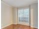 Cozy bedroom with neutral paint and carpeting, and a large window at 2341 Alden, Jonesboro, GA 30236