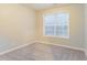 Bright bedroom featuring neutral walls, cozy carpet, and a window providing natural light at 2341 Alden, Jonesboro, GA 30236
