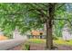 Traditional home with a lush front yard and mature trees providing ample shade at 2341 Alden, Jonesboro, GA 30236