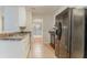 Galley kitchen featuring tile floors, neutral countertops, and black appliances at 2341 Alden, Jonesboro, GA 30236