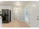 Open kitchen with white cabinets, black appliances, and tile flooring at 2341 Alden, Jonesboro, GA 30236