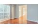 Bright living room featuring hardwood floors and natural light from a large window at 2341 Alden, Jonesboro, GA 30236