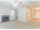 Living room with fireplace, carpet, and view of the staircase at 2341 Alden, Jonesboro, GA 30236