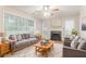 Living room features a cozy fireplace, large windows, and comfortable seating at 2341 Alden, Jonesboro, GA 30236