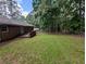 Large backyard featuring lush green grass and a patio area, perfect for outdoor entertaining at 3130 Gay Dr, Decatur, GA 30032