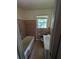 Bathroom featuring a tub with tile surround, a vanity with sink, and a window for natural light at 3130 Gay Dr, Decatur, GA 30032