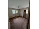 Bedroom featuring hardwood floors, dual windows for natural light, and neutral-colored walls at 3130 Gay Dr, Decatur, GA 30032