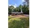 Charming brick home with a single-story layout and a cozy carport, nestled on a hill with mature trees at 3130 Gay Dr, Decatur, GA 30032