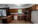 Kitchen with wood cabinets, stainless steel appliances, and a window overlooking the backyard at 3130 Gay Dr, Decatur, GA 30032