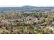 A beautiful neighborhood is captured in this aerial view of tree-lined streets and well-spaced homes at 4076 Shady Nw Cir, Lilburn, GA 30047