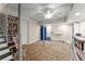 Finished basement featuring carpeted flooring, ceiling fan, support beam, and storage space at 4076 Shady Nw Cir, Lilburn, GA 30047