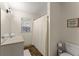 Bathroom featuring a vanity, sink, shower with white curtain and decorative sign at 4076 Shady Nw Cir, Lilburn, GA 30047