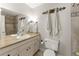 Bright bathroom featuring a sink with a large mirror, decorative towels and ornate hardware at 4076 Shady Nw Cir, Lilburn, GA 30047