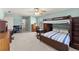 Large bedroom with light blue walls, study area, bunk bed, desk, and neutral carpet at 4076 Shady Nw Cir, Lilburn, GA 30047