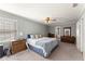 Large bedroom featuring carpet, a ceiling fan, and multiple dressers at 4076 Shady Nw Cir, Lilburn, GA 30047