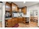 Kitchen area features wood cabinets, granite counters and stainless steel appliances at 4076 Shady Nw Cir, Lilburn, GA 30047