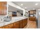 Open kitchen featuring granite counters and a view of the living room at 4076 Shady Nw Cir, Lilburn, GA 30047