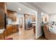 Open kitchen features wooden cabinets and flows into the living area at 4076 Shady Nw Cir, Lilburn, GA 30047