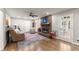 Spacious living room with fireplace, hardwood floors, and natural light at 4076 Shady Nw Cir, Lilburn, GA 30047